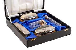 An Edwardian Silver Mounted Five-Piece Dresser Set, H. Matthews, Birmingham, 1902 and Others, comprising three brushes and two s