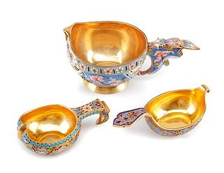 Three Russian Enameled Silver Kovshi, Various Makers, Late 19th/Early 20th Century, each having an exterior decorated with polyc