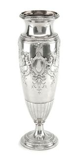 An American Silver Vase, International Silver Co., Meriden, CT, of elongated baluster form, the body worked to show two vacant c