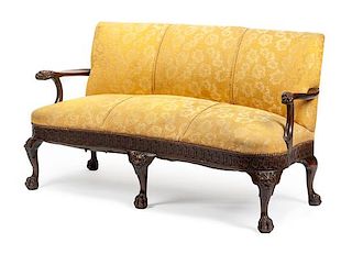 A George II Style Carved Mahogany Sofa Height 35 x width 62 x depth 27 inches.