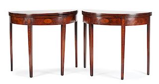 A Pair of George III Mahogany Game Tables Height 30 1/2 x width 35 1/2 x depth 18 inches.