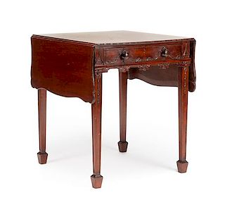 A George III Style Carved Mahogany Pembroke Table Height 27 1/2 x width 26 (closed) x depth 24 inches.
