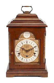 An English Mahogany Table Clock Height 16 1/2 x width 10 x depth 6 1/2 inches.