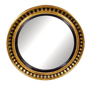 A Regency Style Parcel Ebonized Giltwood Mirror Diameter 45 1/2 inches.