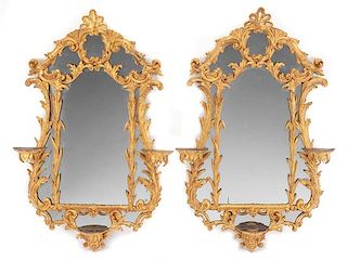 A Pair of Chippendale Style Carved Giltwood Mirrors Height 42 x width 27 inches.
