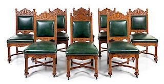 A Set of Eight Victorian Renaissance Revival Oak Dining Chairs Height 42 inches.