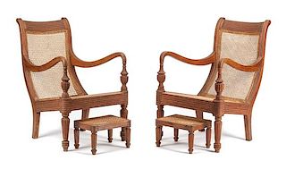 A Pair of Anglo-Colonial Caned Armchairs Height of armchair 39 x width 26 x depth 34 inches.