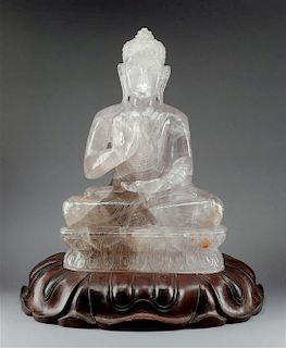 A Chinese Carved Rock Crystal Figure Height 20 x width 14 inches.