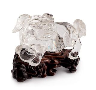 A Chinese Carved Rock Crystal Figure Height 6 1/2 x width 12 inches.
