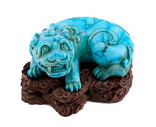 A Chinese Carved Turquoise Figure Height 1 1/2 inches.