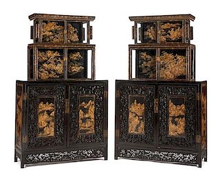 A Pair of Chinese Carved and Lacquered Cabinets Height 81 x width 51 x depth 18 1/2 inches.