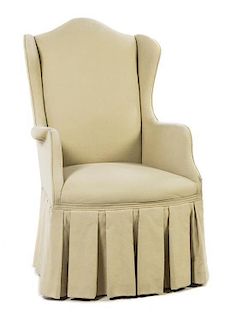 An Upholstered Wingback Chair, Baker, Height 43 inches.