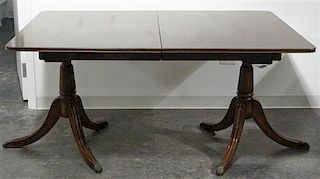 A Federal Style Mahogany Double Pedestal Dining Table, Width 62 inches.