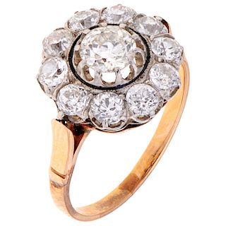 A diamond 18K and 14K yellow and white gold ring.