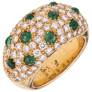 An emerald and diamond 18K yellow gold ring.