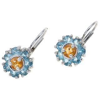 A citrine and topaz 14K white gold pair of earrings.