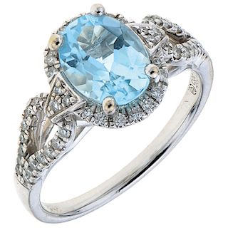 A topaz and diamond 14K white gold ring.