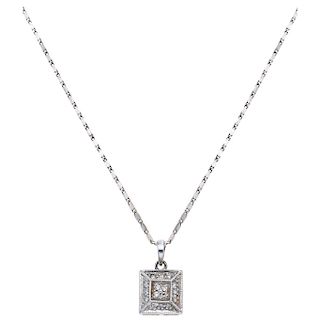 A 14K white gold necklace and diamond pendant.