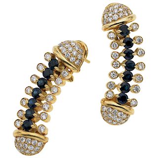A sapphire and diamond 18K yellow gold pair of earrings.