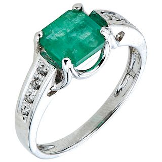 An emerald and diamond 14K white gold ring.