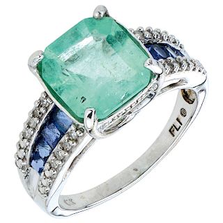 An emerald, sapphire and diamond 10K white gold ring.