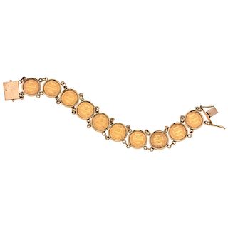 A 10K yellow gold bracelet with ten 21.6K yellow gold coins.