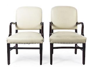 A Pair of Leather Upholstered Arm Chairs, Height 38 inches.