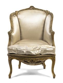 A Louis XV Style Giltwood Bergere a Oreilles, Height 37 7/8 inches.