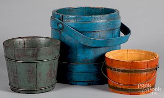 Three painted buckets