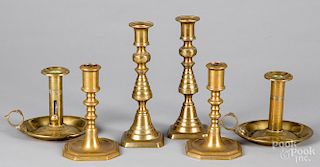 Three pairs of English brass candlesticks