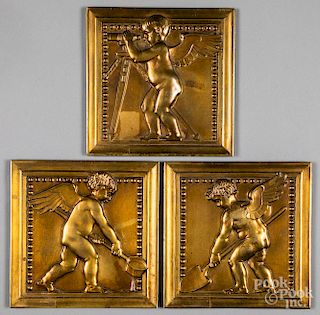 Three bronze plaques