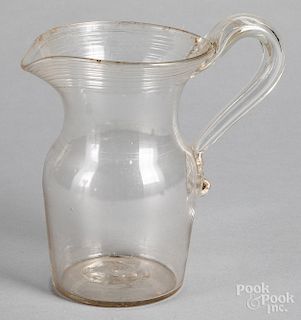Free-blown colorless glass pitcher