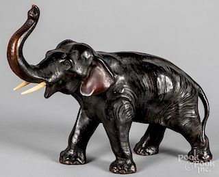 Bronze wrapped elephant with ivory tusks