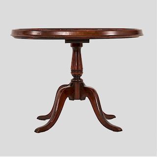 A Georgian Style Mahogany Oval Low Table with Glass Top, 20th Century.