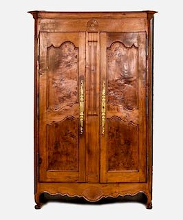 A French Provincial Maple and Walnut Armoire, 19th/20th Century.
