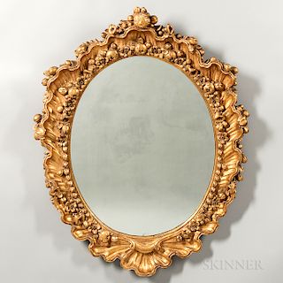 Pair of Carved and Gilded Oval Mirrors