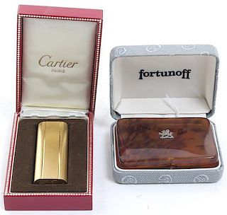 A Cartier Gold Plated Cigarette Lighter, Height of lighter 2 3/4 inches.