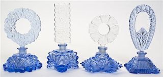 A Set of Four Cut Glass Perfumes, Height overall 7 1/4 inches.