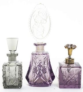 A Set of Three Cut Glass Perfumes, Height of tallest 6 1/2 inches.