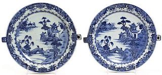 A Near Pair of Blue and White Decorated Warming Dishes, Width at widest 10 3/8 inches.
