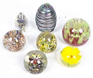 A Collection of Seven Glass Paperweights, Height of tallest 3 1/4 inches.