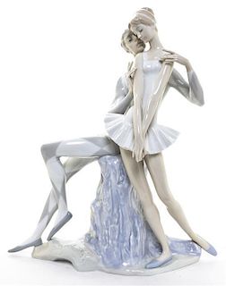A Lladro Porcelain Figural Group, Height 14 inches.
