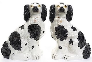 A Pair of Staffordshire Spaniels, Height 9 1/4 inches.
