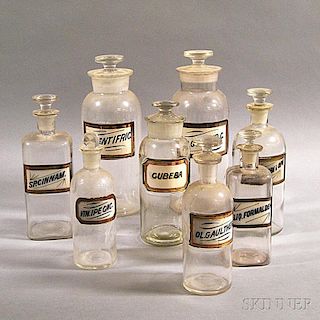 Eight Colorless Glass Apothecary Jars