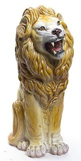 An Italian Glazed Terra Cotta Model of a Lion, Height 22 inches.