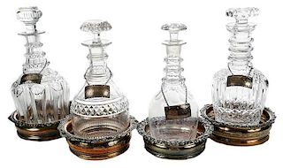 Four Decanters with Silver Tags and Coasters