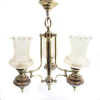 LOTE SIN RESERVA. Siglo XX. Estructura de latón dorado con aplicaciones de cerámica color café. Para 3 luces.