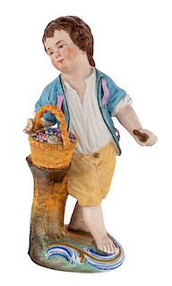 A RUSSIAN PORCELAIN FIGURE OF A BOY WITH A FLOWER BASKET, POPOV PORCELAIN FACTORY, FIRST HALF OF 19TH CENTURY