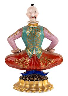 A RUSSIAN PORCELAIN PERFUME BOTTLE IN THE FORM OF MONGOLIAN MAN, GARDNER PORCELAIN FACTORY, MOSCOW, MID-19TH CENTURY