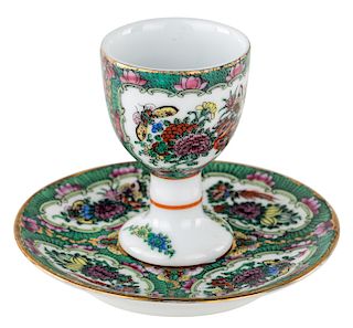 A SMALL GILT PORCELAIN DRINKING CUP AND SAUCER
